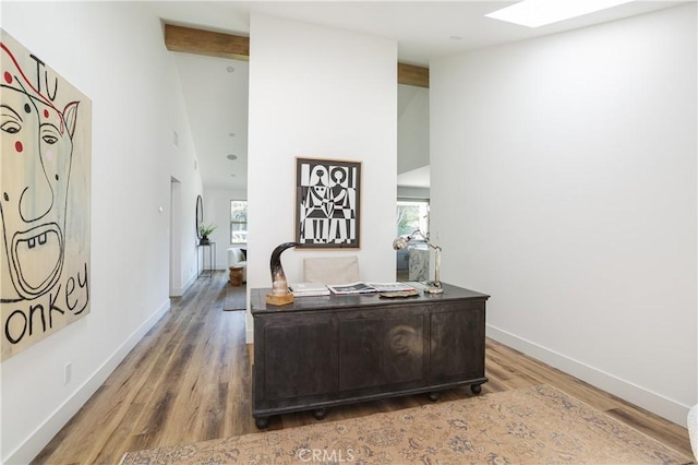 212 E 19th St, Costa Mesa, CA 92627 - home office featuring wood finished floors, beamed ceiling, a skylight, and high vaulted ceiling