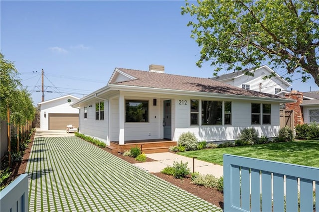 212 E 19th St, Costa Mesa, CA 92627 - ranch-style house with an outbuilding, a detached garage, a front lawn, covered porch, and a chimney