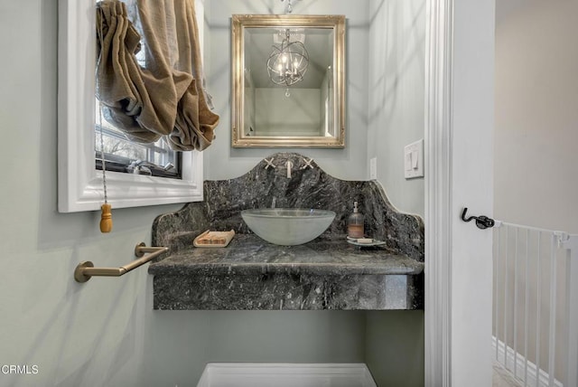 9999 Wornom Ave, Sunland, CA 91040 - bathroom with a sink and a chandelier