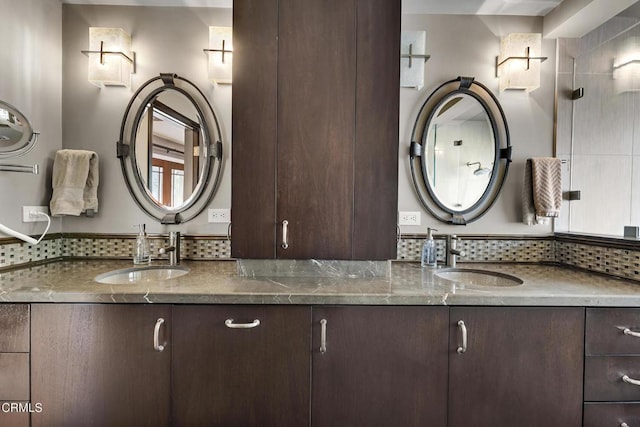 9999 Wornom Ave, Sunland, CA 91040 - bathroom featuring double vanity and decorative backsplash