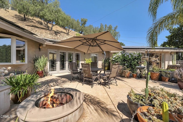 9999 Wornom Ave, Sunland, CA 91040 - view of patio with french doors, an outdoor fire pit, and outdoor dining area