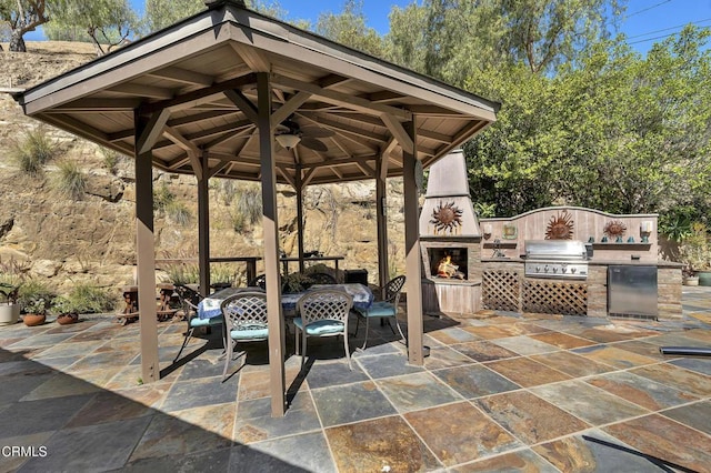 9999 Wornom Ave, Sunland, CA 91040 - view of patio / terrace with an outdoor stone fireplace, a gazebo, and exterior kitchen
