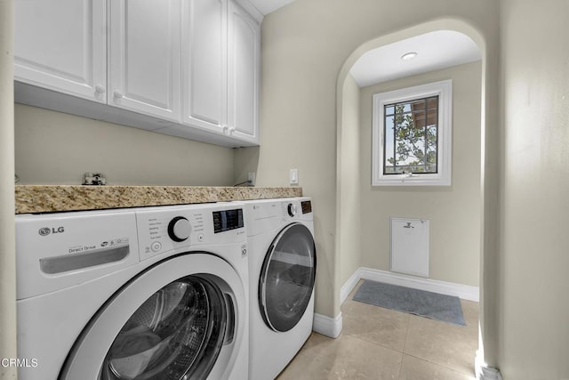 9999 Wornom Ave, Sunland, CA 91040 - laundry room featuring independent washer and dryer, cabinet space, and light tile patterned floors