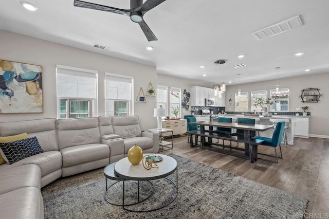 11015 Peyton Way, San Diego, CA 92129 - living area with dark wood-style floors, recessed lighting, and a ceiling fan