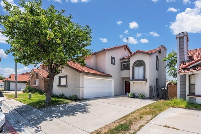 1407 Sycamore Ln, San Bernardino, CA 92408 - mediterranean / spanish-style home with stucco siding, a tiled roof, driveway, and a chimney