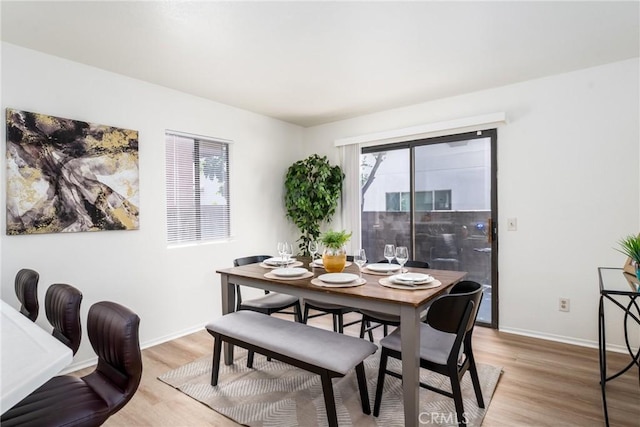 1407 Sycamore Ln, San Bernardino, CA 92408 - dining room with light wood-style flooring and plenty of natural light