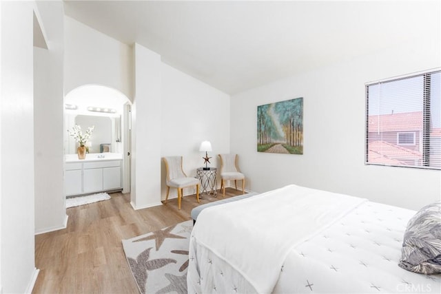 1407 Sycamore Ln, San Bernardino, CA 92408 - bedroom featuring wood finished floors, lofted ceiling, and ensuite bathroom