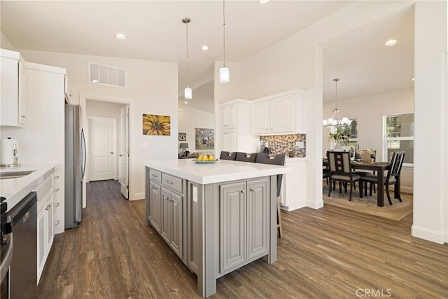 635 Boquest Blvd, Paradise, CA 95969 - kitchen featuring stainless steel appliances, gray cabinets, dark wood-type flooring, a chandelier, and a center island