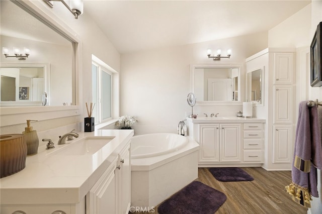 635 Boquest Blvd, Paradise, CA 95969 - full bath featuring two vanities, a bath, and wood finished floors