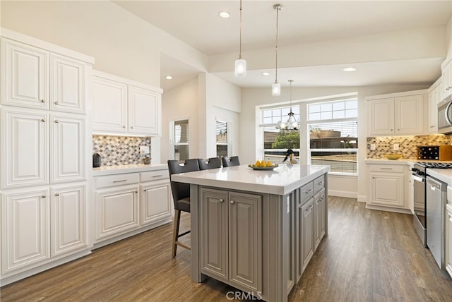 635 Boquest Blvd, Paradise, CA 95969 - kitchen with gray cabinets, appliances with stainless steel finishes, dark wood-type flooring, tasteful backsplash, and recessed lighting
