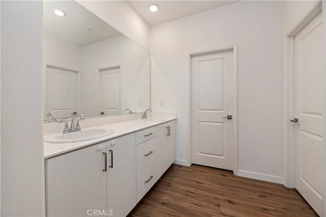 5680 Kate Way Unit 5, Fontana, CA 92336 - bathroom with double vanity, wood finished floors, and recessed lighting