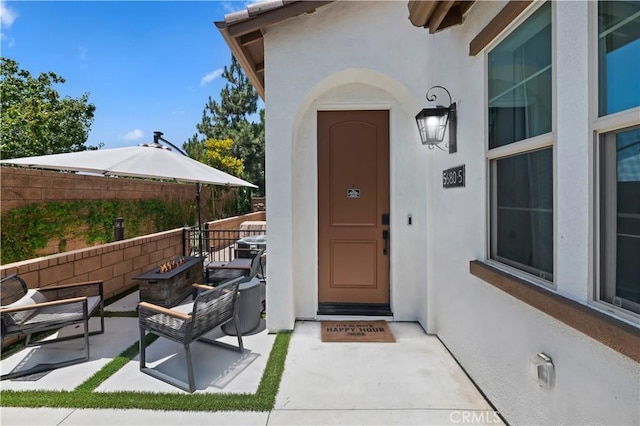 5680 Kate Way Unit 5, Fontana, CA 92336 - view of exterior entry with stucco siding and a patio area