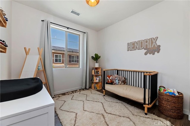 5680 Kate Way Unit 5, Fontana, CA 92336 - bedroom with baseboards and wood finished floors