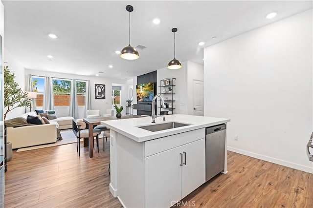 5680 Kate Way Unit 5, Fontana, CA 92336 - kitchen with dishwasher, open floor plan, recessed lighting, light wood finished floors, and light countertops