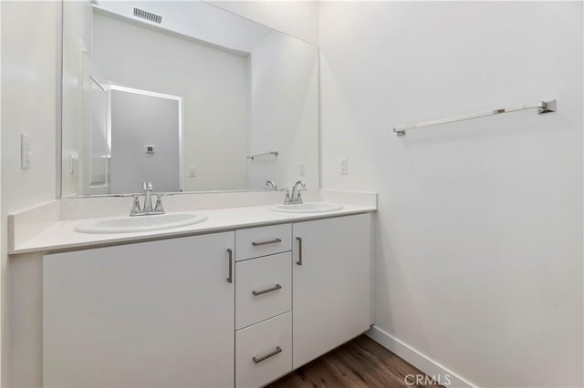 5680 Kate Way Unit 5, Fontana, CA 92336 - bathroom with double vanity and wood finished floors