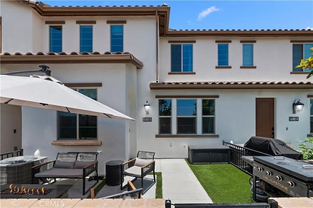 5680 Kate Way Unit 5, Fontana, CA 92336 - rear view of house with a patio, stucco siding, a tiled roof, and an outdoor hangout area
