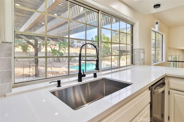 20591 Celtic St, Chatsworth, CA 91311 - kitchen with light countertops, decorative light fixtures, and healthy amount of natural light