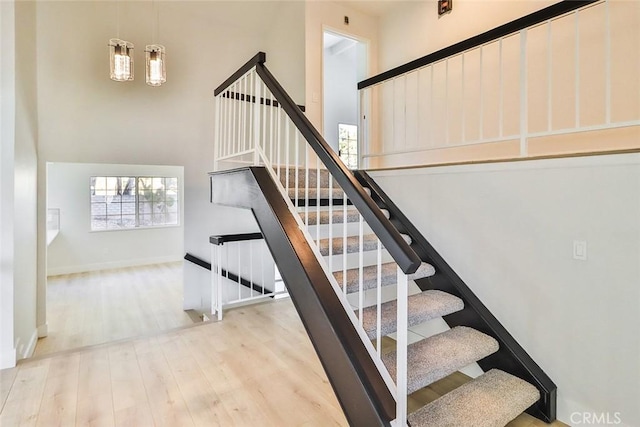 20591 Celtic St, Chatsworth, CA 91311 - stairway with wood finished floors and a towering ceiling