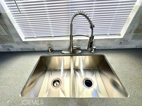 2748 Delmar Ave, Mojave, CA 93501 - kitchen view of decorative backsplash and dark countertops