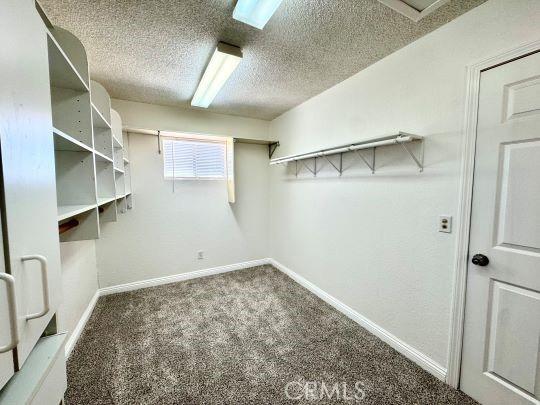 2748 Delmar Ave, Mojave, CA 93501 - walk in closet with carpet flooring