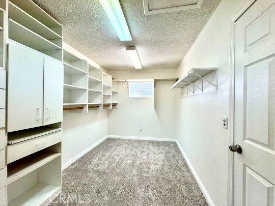 2748 Delmar Ave, Mojave, CA 93501 - spacious closet featuring carpet flooring
