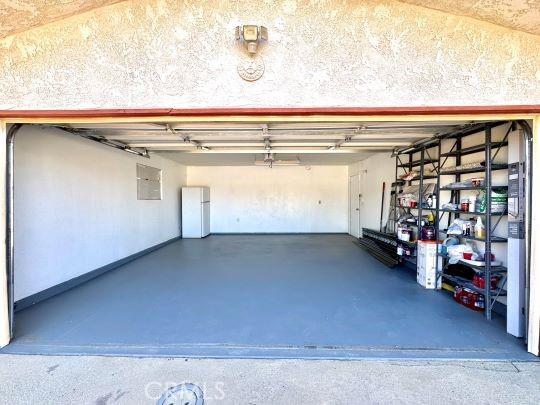 2748 Delmar Ave, Mojave, CA 93501 - garage with freestanding refrigerator