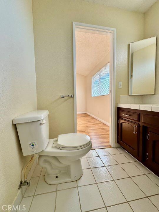 2748 Delmar Ave, Mojave, CA 93501 - half bath featuring vanity and tile patterned flooring