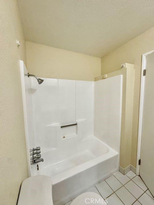 2748 Delmar Ave, Mojave, CA 93501 - bathroom with tile patterned flooring, a textured wall, and bathtub / shower combination
