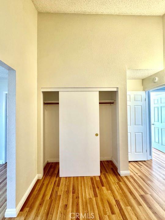 2748 Delmar Ave, Mojave, CA 93501 - unfurnished bedroom featuring a closet and wood finished floors