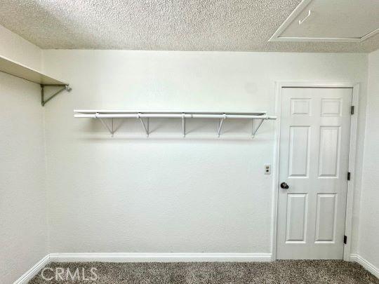 2748 Delmar Ave, Mojave, CA 93501 - spacious closet with carpet and attic access