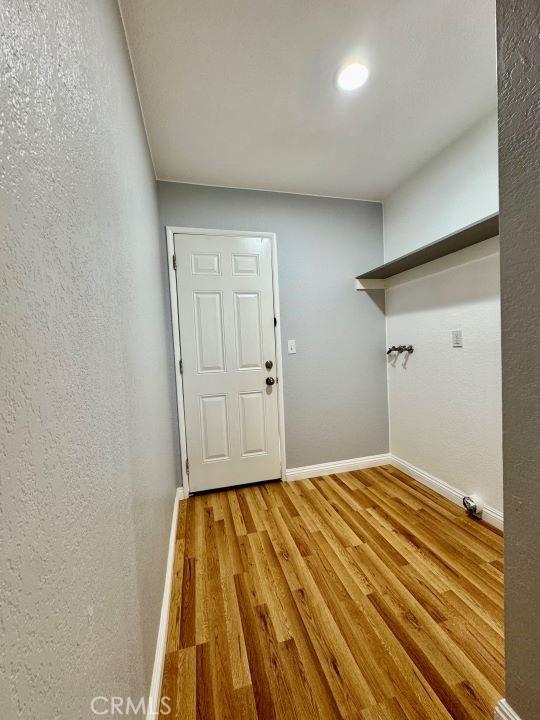 2748 Delmar Ave, Mojave, CA 93501 - washroom featuring light wood finished floors and baseboards