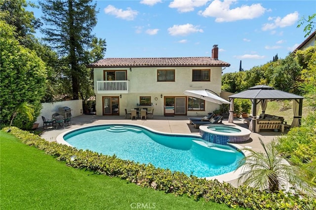 10411 Windtree Dr, Los Angeles, CA 90077 - rear view of house with a gazebo, a patio area, a chimney, and stucco siding