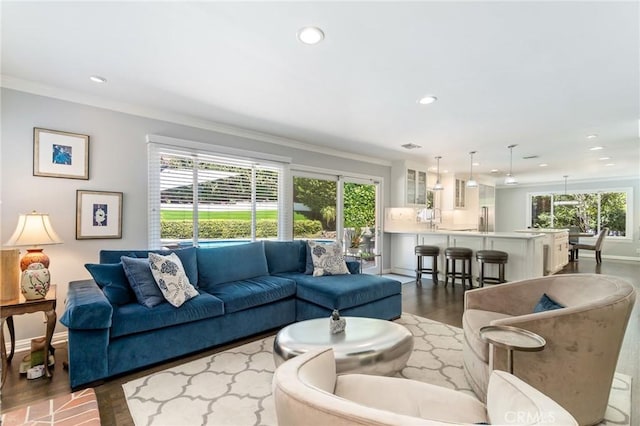 10411 Windtree Dr, Los Angeles, CA 90077 - living room featuring ornamental molding, wood finished floors, and recessed lighting