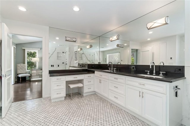 10411 Windtree Dr, Los Angeles, CA 90077 - full bathroom with double vanity, a stall shower, and recessed lighting