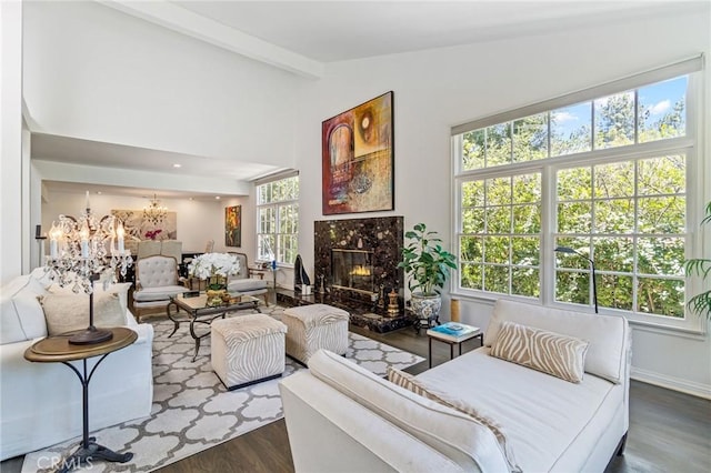 10411 Windtree Dr, Los Angeles, CA 90077 - living room featuring a chandelier, wood finished floors, and a fireplace