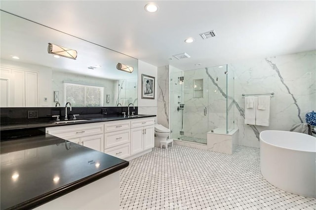 10411 Windtree Dr, Los Angeles, CA 90077 - bathroom with a marble finish shower, a soaking tub, double vanity, and recessed lighting