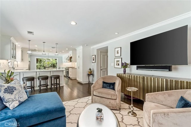 10411 Windtree Dr, Los Angeles, CA 90077 - living area featuring dark wood-style flooring, ornamental molding, and recessed lighting