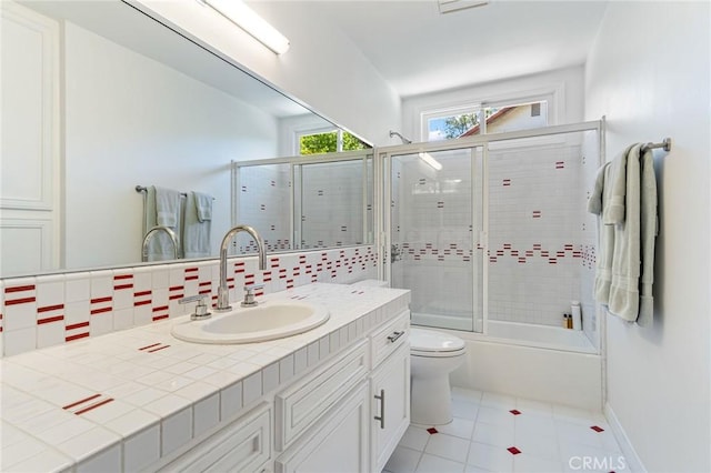 10411 Windtree Dr, Los Angeles, CA 90077 - full bathroom featuring vanity, decorative backsplash, enclosed tub / shower combo, and tile patterned flooring