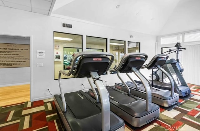 10411 Windtree Dr, Los Angeles, CA 90077 - workout area with lofted ceiling and wood finished floors