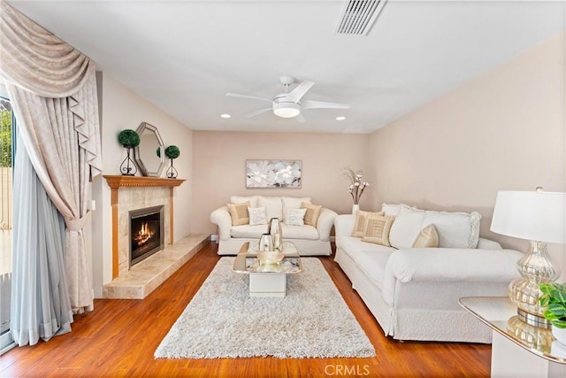 4360 E Addington Dr, Anaheim, CA 92807 - living area with a ceiling fan, a tile fireplace, wood finished floors, and recessed lighting
