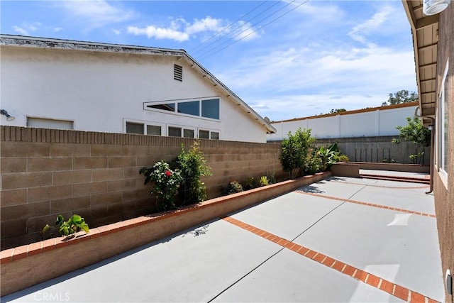 4360 E Addington Dr, Anaheim, CA 92807 - fenced backyard with a patio area
