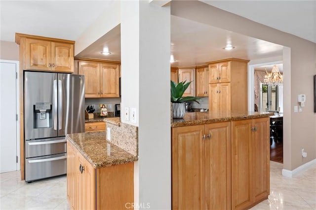 4360 E Addington Dr, Anaheim, CA 92807 - kitchen featuring stainless steel refrigerator with ice dispenser, stone counters, light tile patterned floors, a chandelier, and recessed lighting