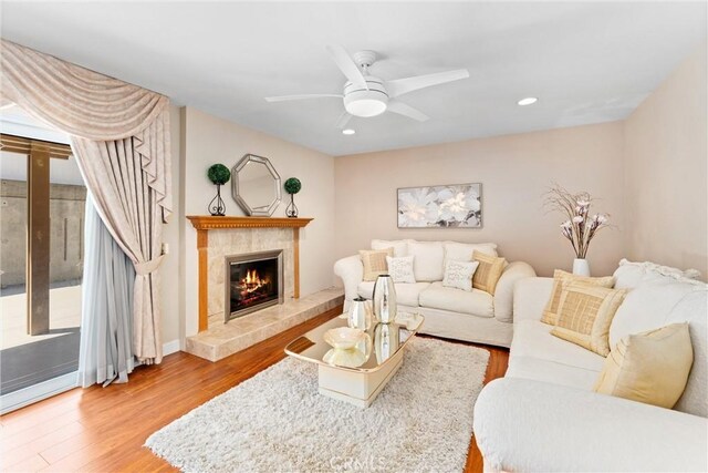 4360 E Addington Dr, Anaheim, CA 92807 - living area with a fireplace, wood finished floors, ceiling fan, and recessed lighting