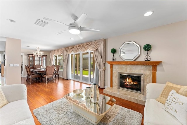 4360 E Addington Dr, Anaheim, CA 92807 - living area with a ceiling fan, a fireplace, wood finished floors, a chandelier, and recessed lighting