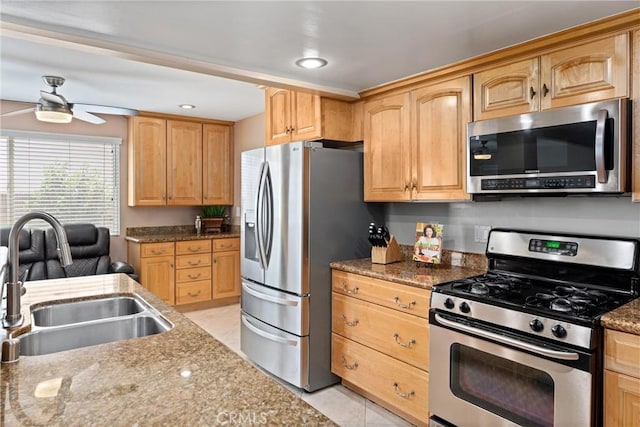 4360 E Addington Dr, Anaheim, CA 92807 - kitchen with appliances with stainless steel finishes, a ceiling fan, light stone counters, light brown cabinets, and recessed lighting