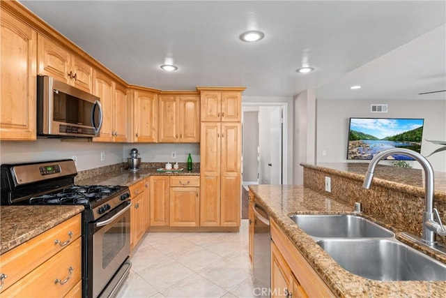 4360 E Addington Dr, Anaheim, CA 92807 - kitchen featuring stainless steel appliances, dark stone countertops, light tile patterned flooring, recessed lighting, and light brown cabinetry