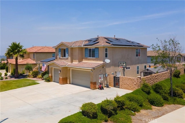 18094 Olivenhain Dr, Riverside, CA 92508 - view of front of property featuring a garage, roof mounted solar panels, stucco siding, driveway, and a tiled roof