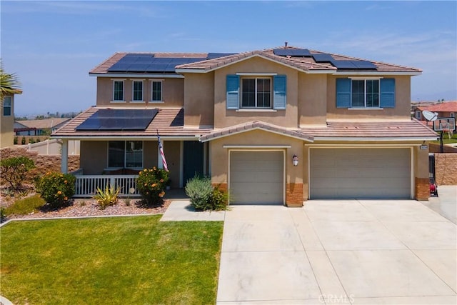 18094 Olivenhain Dr, Riverside, CA 92508 - view of front of house featuring covered porch, solar panels, a garage, and a front yard