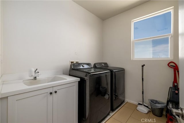 18094 Olivenhain Dr, Riverside, CA 92508 - washroom featuring washer and dryer, cabinet space, and light tile patterned floors