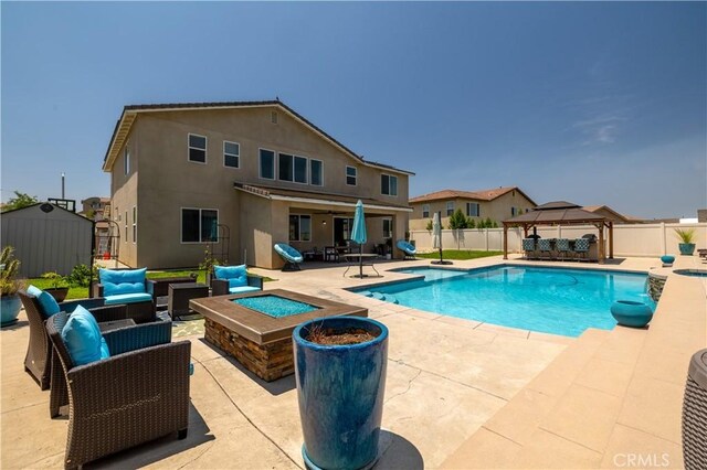 18094 Olivenhain Dr, Riverside, CA 92508 - view of pool with a gazebo, an outdoor living space with a fire pit, a patio, a fenced backyard, and outdoor dining area